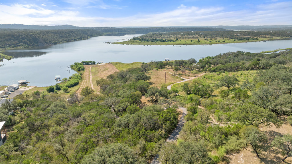 111 Swift Water Road Marble Falls, TX 78654 - Photo 17 of 37 a view of a lake with houses in the back