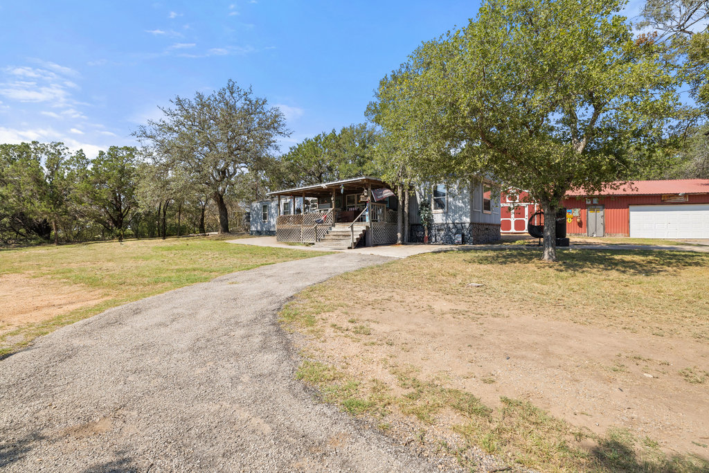 111 Swift Water Road Marble Falls, TX 78654 - Photo 27 of 37 a view of a house with a yard and covered with snow