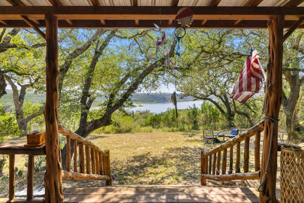 111 Swift Water Road Marble Falls, TX 78654 - Photo 31 of 37 a view of a backyard with a large tree