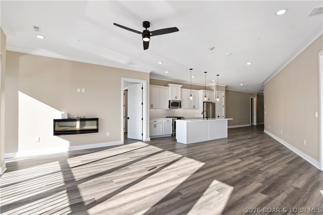 1184 Jeffries Road, Unit 218 Osage Beach, MO 65065 - Photo 5 of 46 The ambient light brightens up the space. The lak