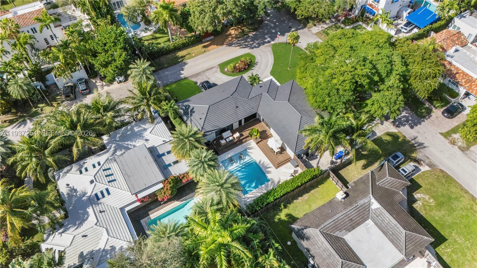 800 Northeast 72nd Street Miami, FL 33138 - Photo 2 of 48 an aerial view of a house with a yard and swimming pool