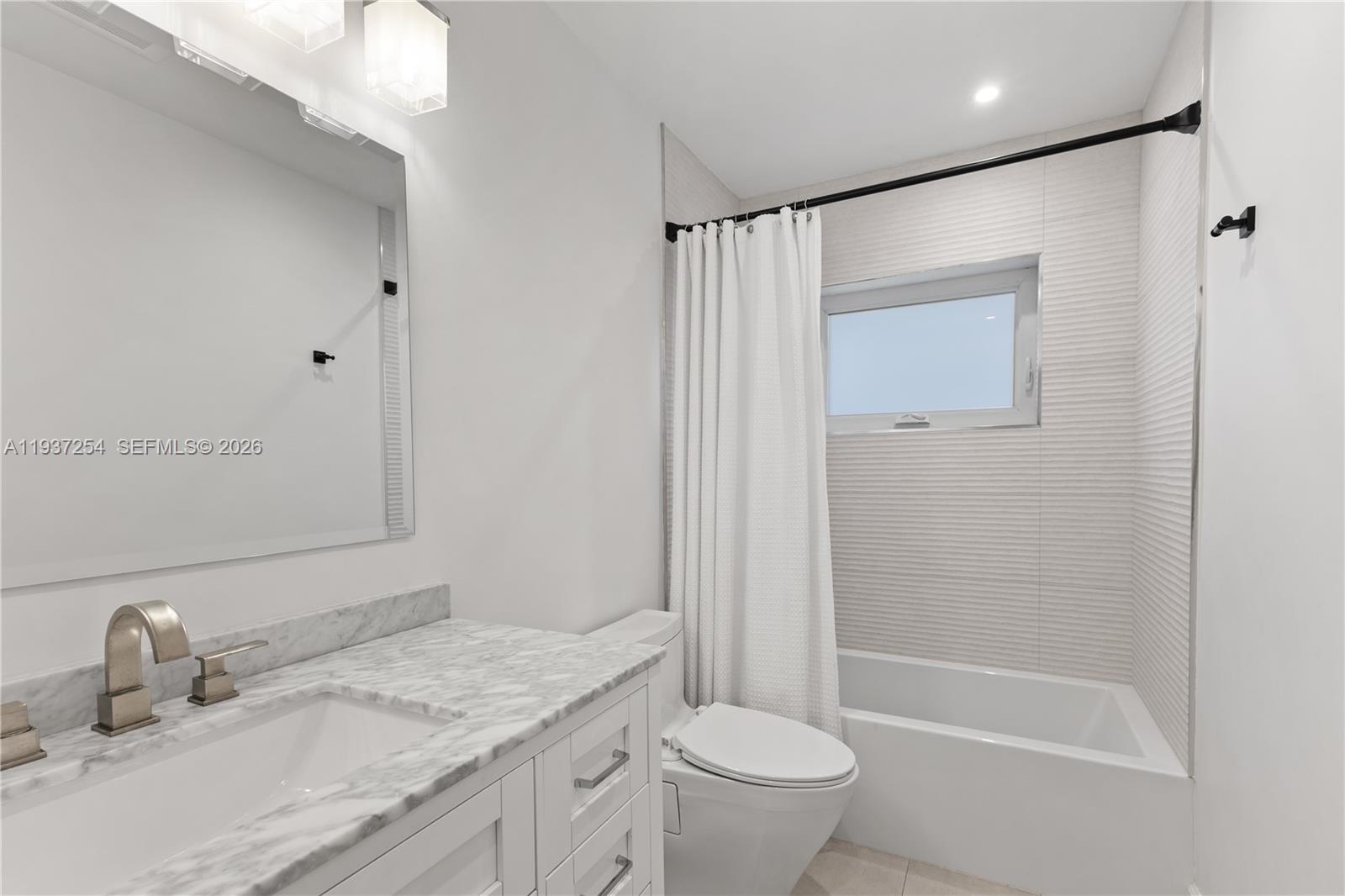 800 Northeast 72nd Street Miami, FL 33138 - Photo 22 of 48 a bathroom with a granite countertop sink toilet and shower