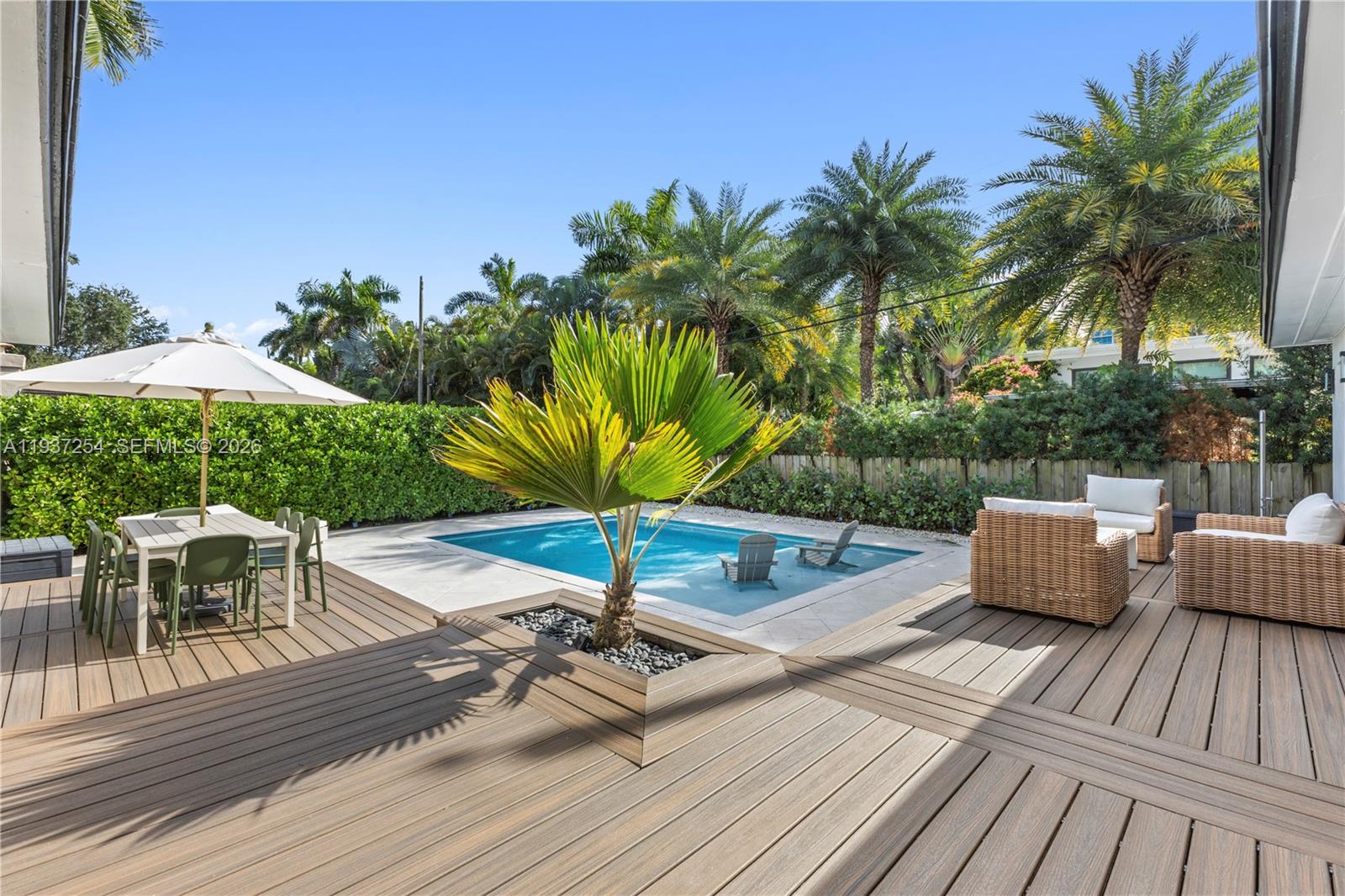 800 Northeast 72nd Street Miami, FL 33138 - Photo 30 of 48 a view of a roof deck with chair and wooden floor