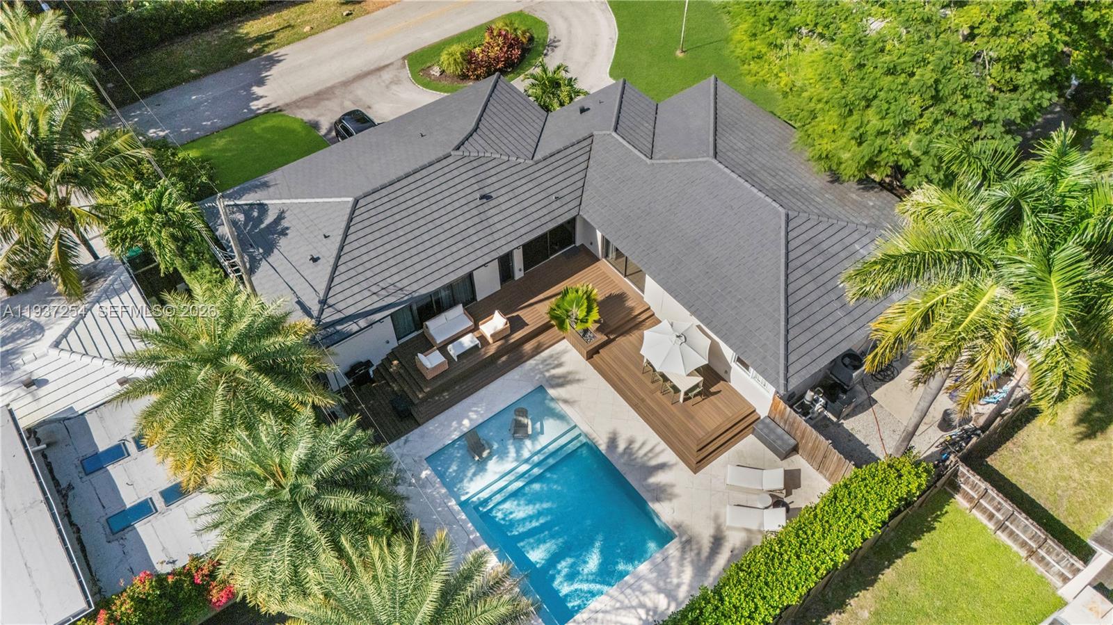800 Northeast 72nd Street Miami, FL 33138 - Photo 43 of 48 an aerial view of a house with a yard and potted plants