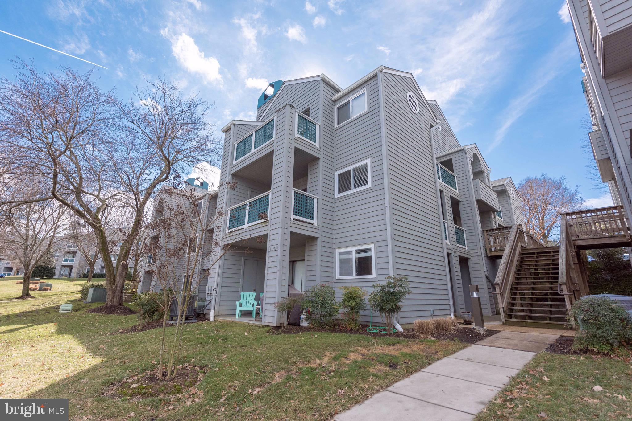 11708 Summerchase Circle, Unit 1708E Reston, VA 20194 - Photo 1 of 17 a view of a building with a yard