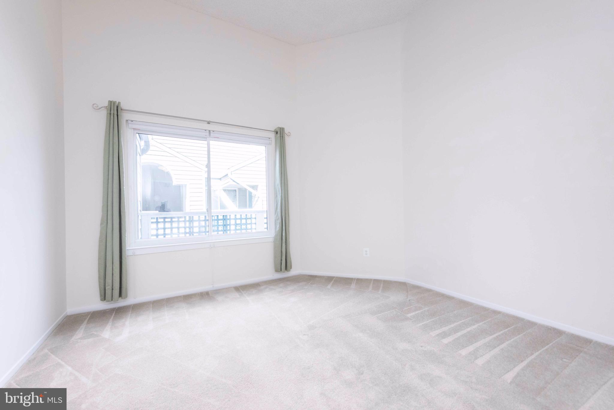 11708 Summerchase Circle, Unit 1708E Reston, VA 20194 - Photo 14 of 17 a view of an empty room with a window