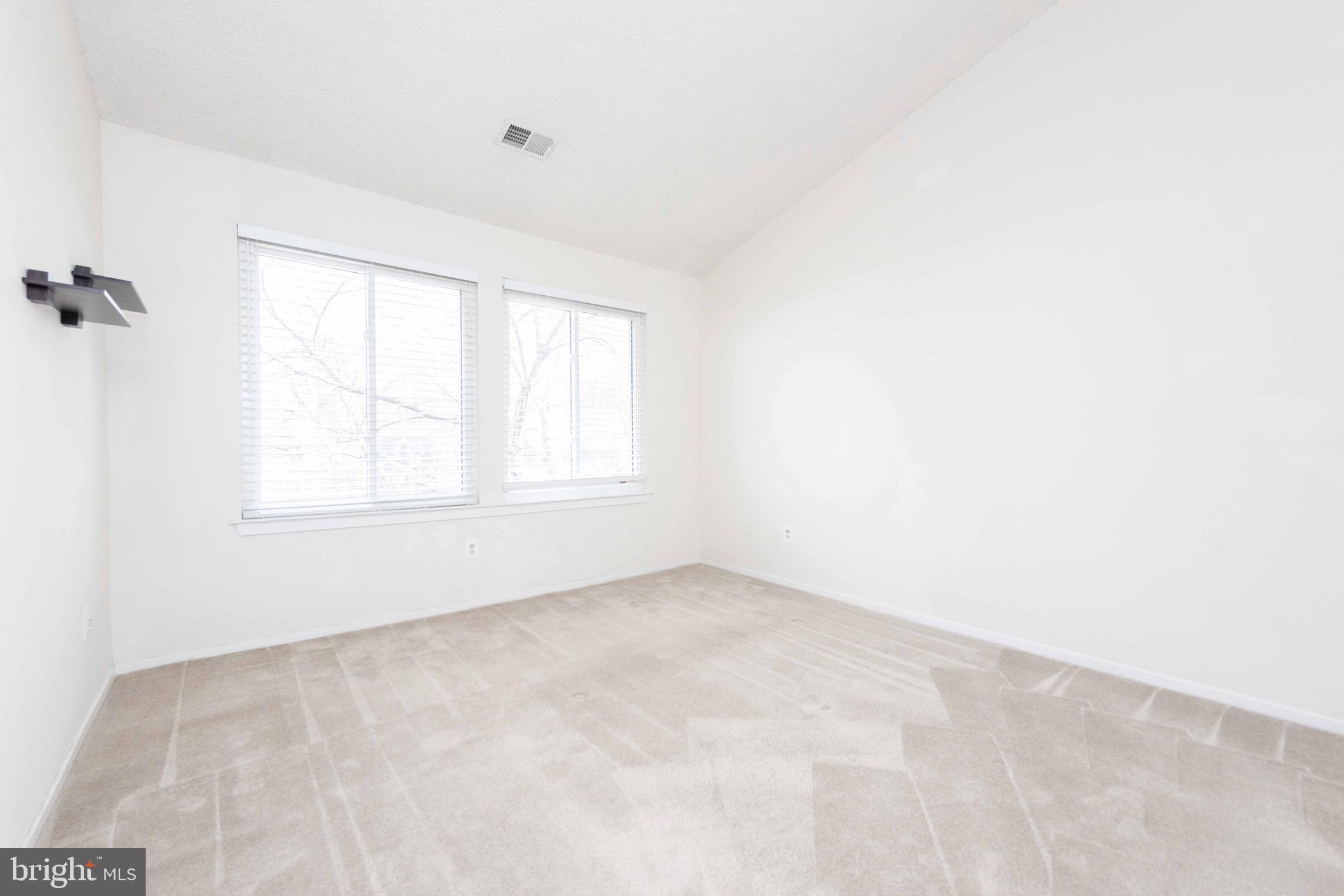 11708 Summerchase Circle, Unit 1708E Reston, VA 20194 - Photo 9 of 17 an empty room with windows