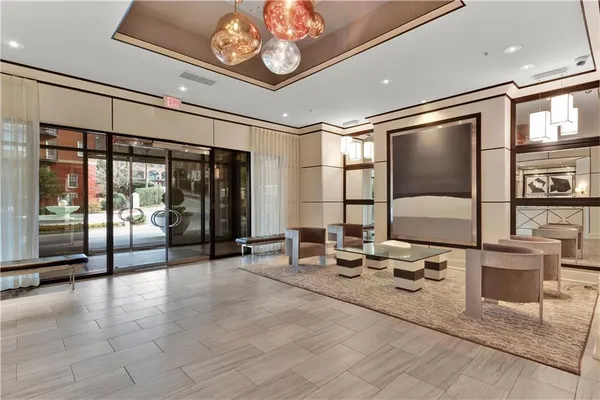 a lobby with furniture and window