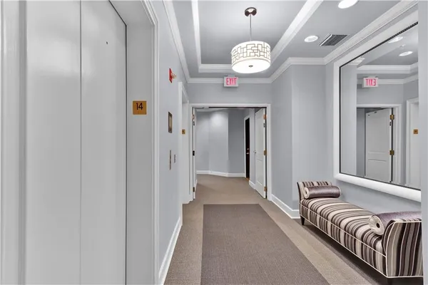 a view of a hallway with a chandelier