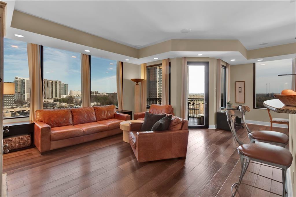 2828 Peachtree Road Northwest, Unit 1402 Atlanta, GA 30305 - Photo 10 of 23 a living room with furniture and a large window