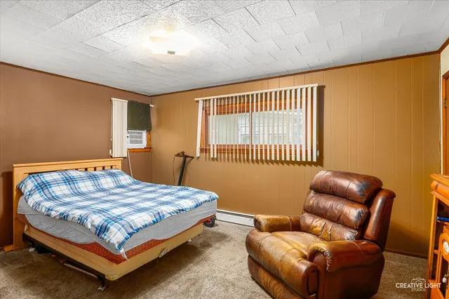 a bedroom with bed and a window