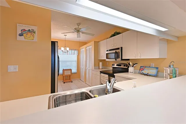 a bedroom with furniture and a large window