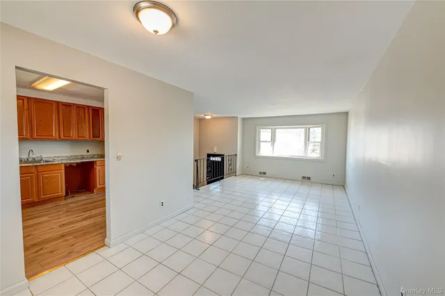 a view of a kitchen with furniture and a window