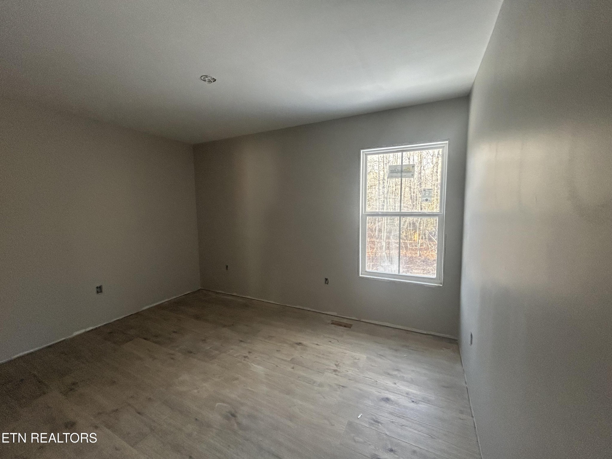 59 C C C Road Monterey, TN 38574 - Photo 6 of 13 an empty room with a window