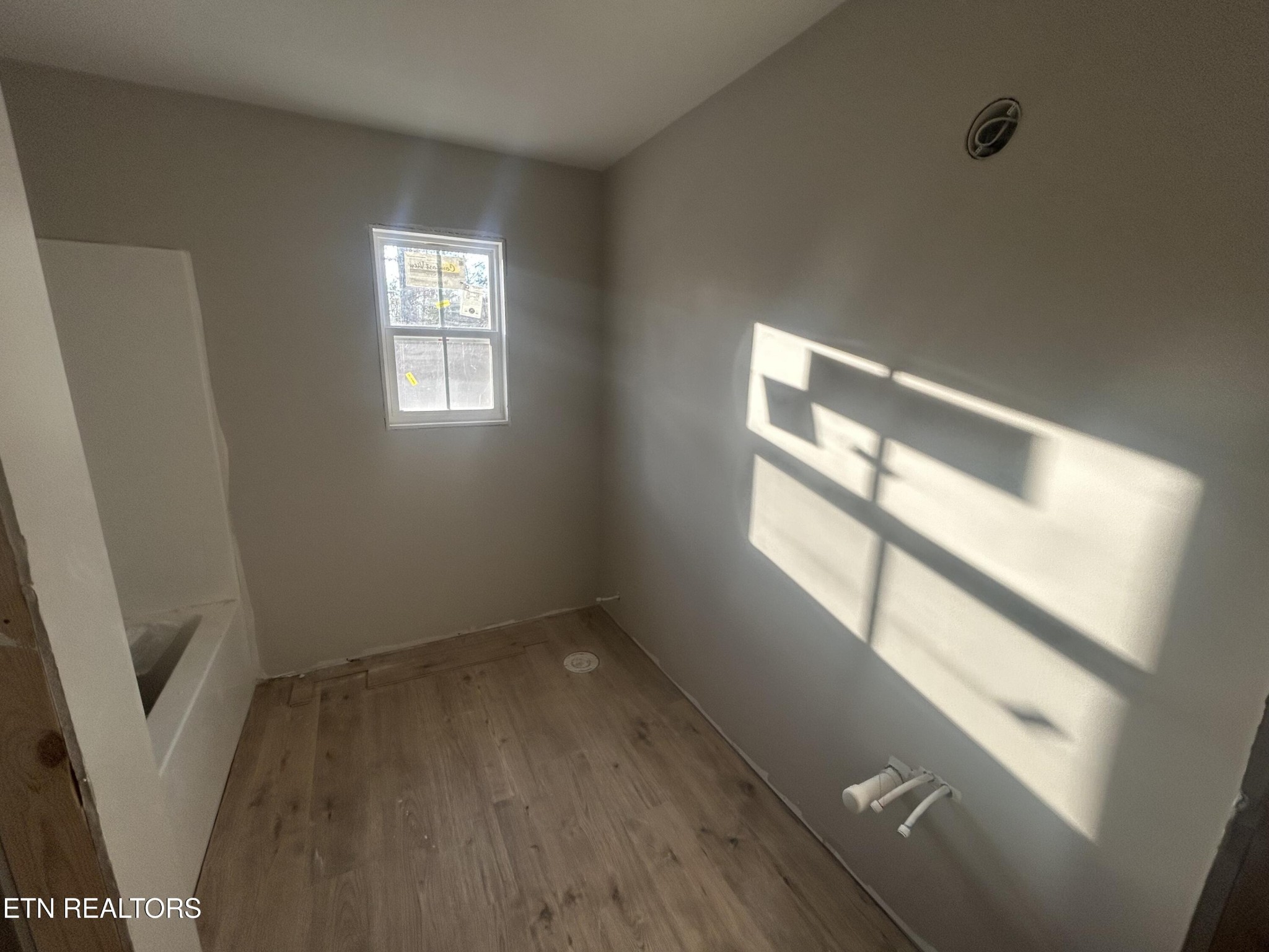 59 C C C Road Monterey, TN 38574 - Photo 7 of 13 a view of empty room with windows