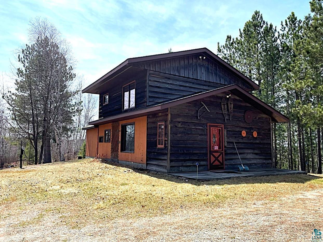1480 Maijala Road Ely, MN 55731 - Photo 2 of 58 Rustic-style two-story residence featuring wood siding.