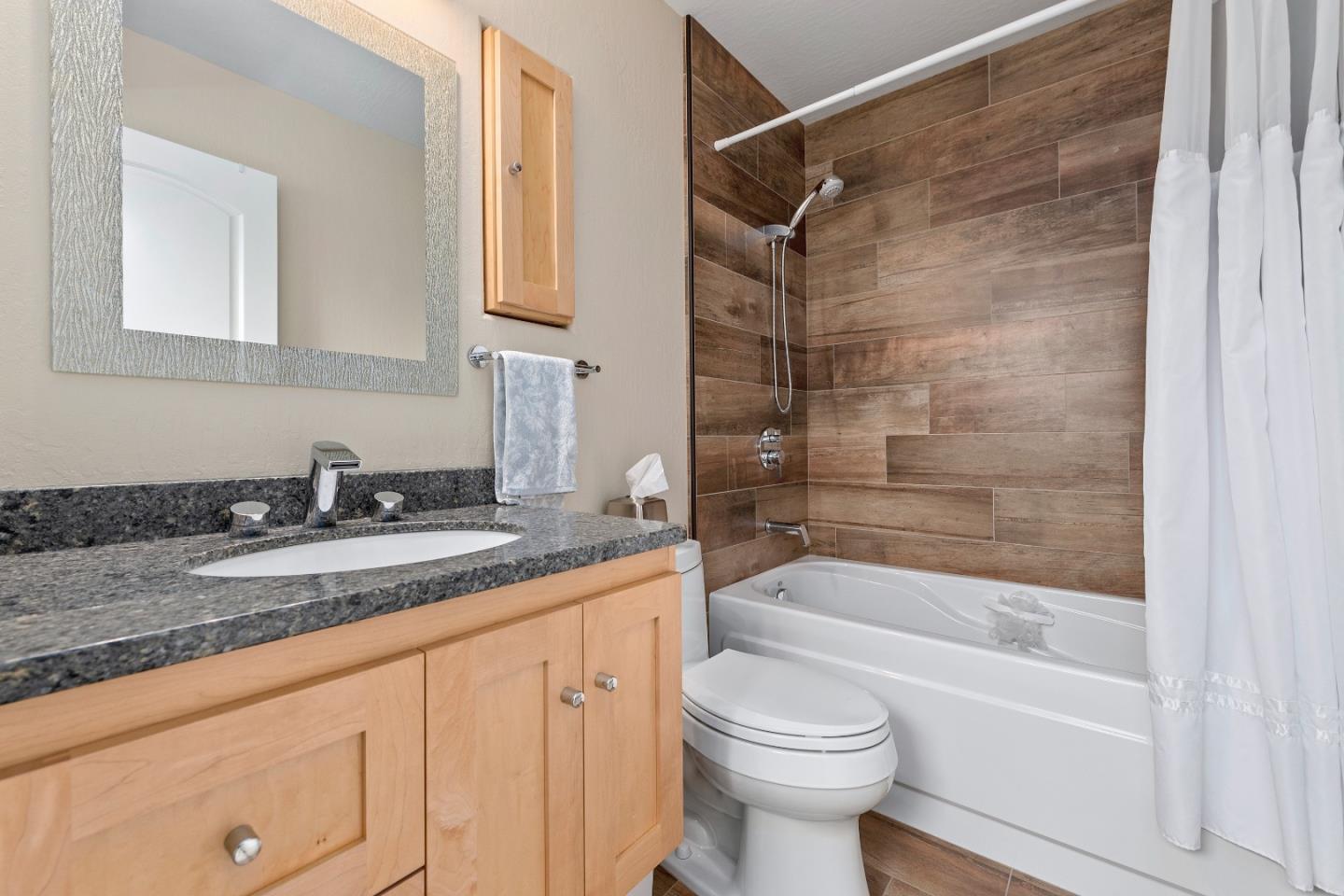 2455 Fairview Lane Santa Clara, CA 95051 - Photo 15 of 25 a bathroom with a granite countertop sink toilet and shower