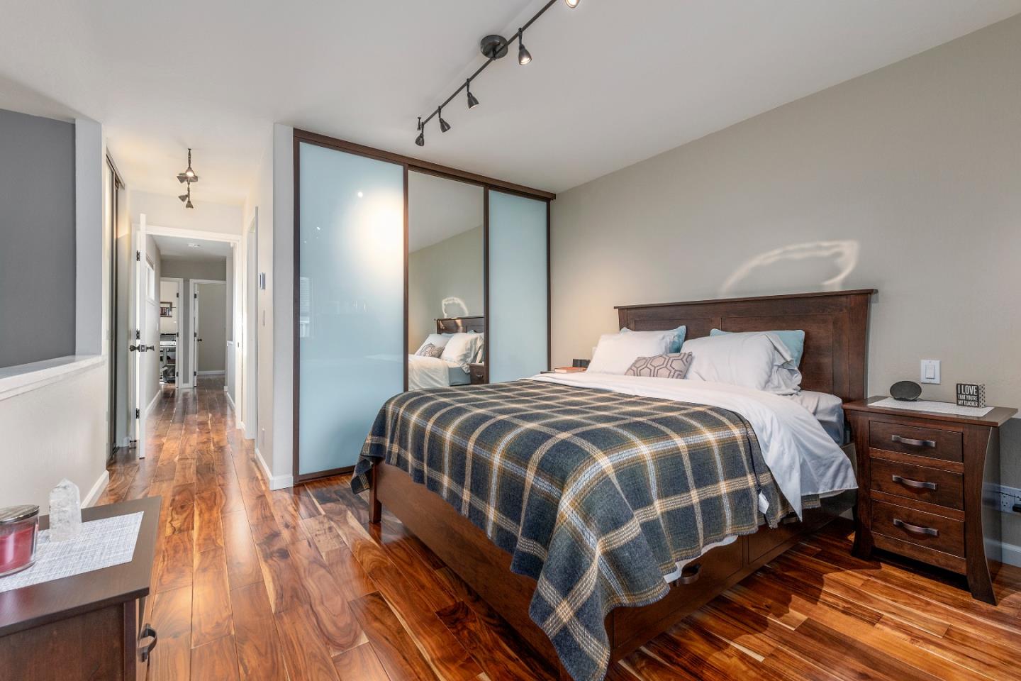 2455 Fairview Lane Santa Clara, CA 95051 - Photo 17 of 25 a bedroom with a bed and wooden floor