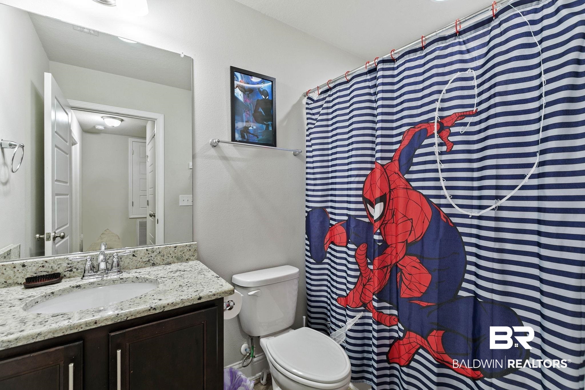 25806 Pollard Road, Unit 24 Daphne, AL 36526 - Photo 23 of 33 Bathroom with vanity and curtained shower