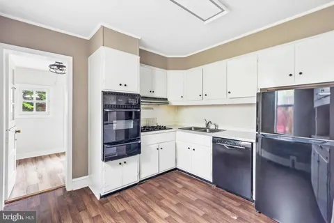 a kitchen with stainless steel appliances granite countertop a stove and a refrigerator