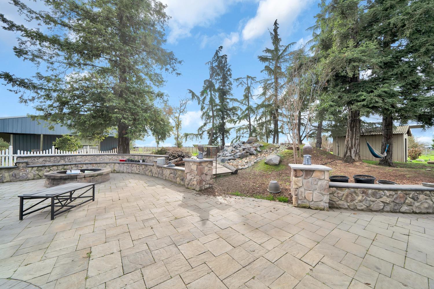 5420 East Jahant Road Galt, CA 95632 - Photo 25 of 73 a view of a backyard with sitting area