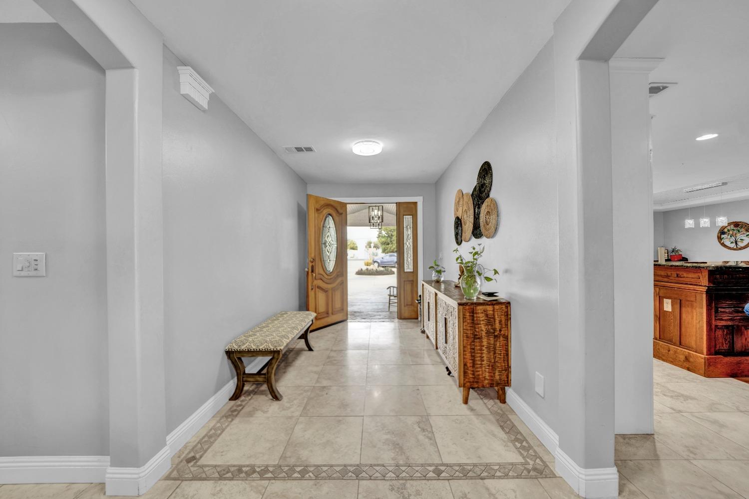 5420 East Jahant Road Galt, CA 95632 - Photo 35 of 73 a view of a hallway with furniture and a window
