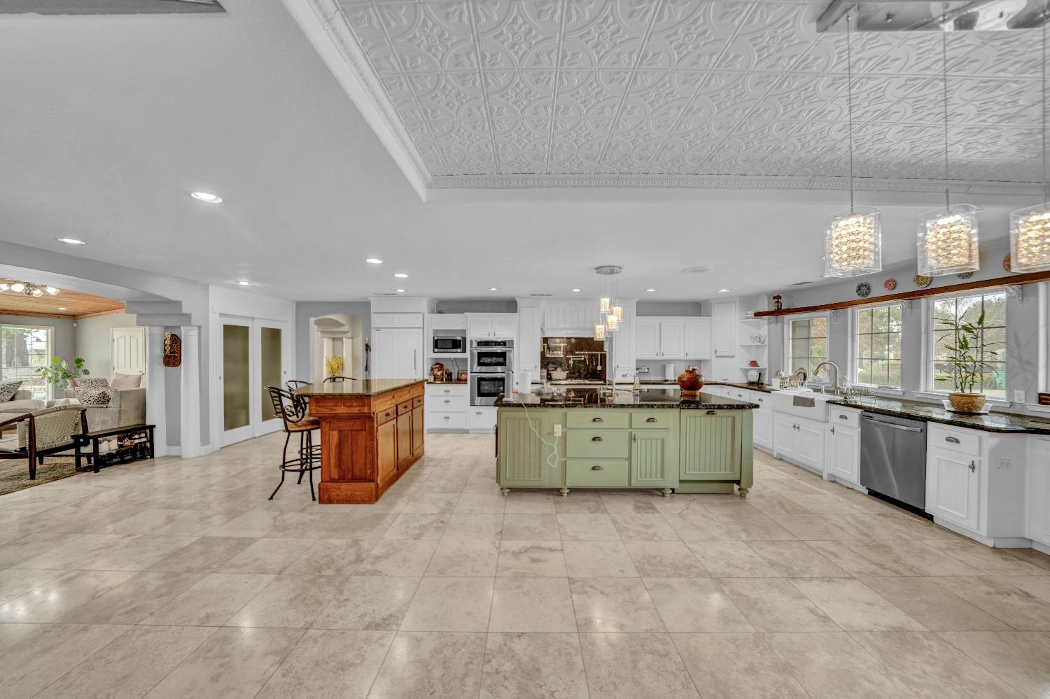 5420 East Jahant Road Galt, CA 95632 - Photo 40 of 73 a kitchen with a sink and a stove top oven