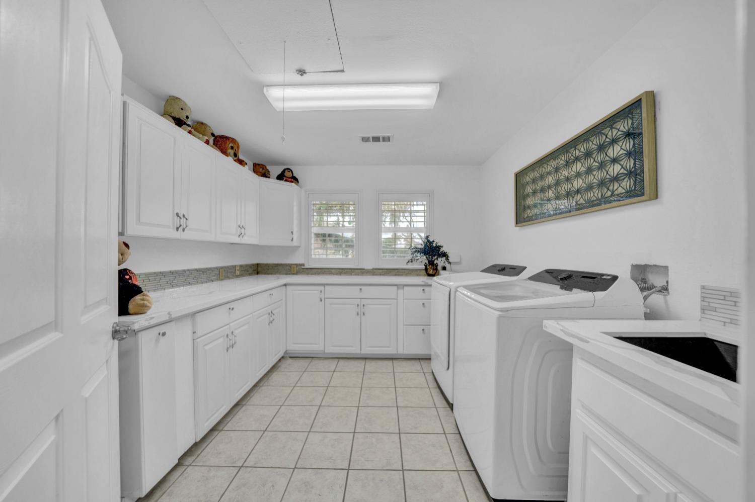 5420 East Jahant Road Galt, CA 95632 - Photo 59 of 73 a kitchen with a sink cabinets and window