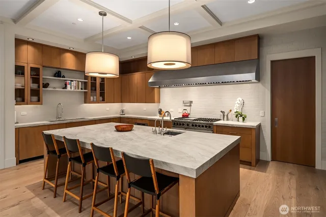 a kitchen with a dining table and chairs