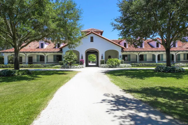 a house with lots of trees in the background
