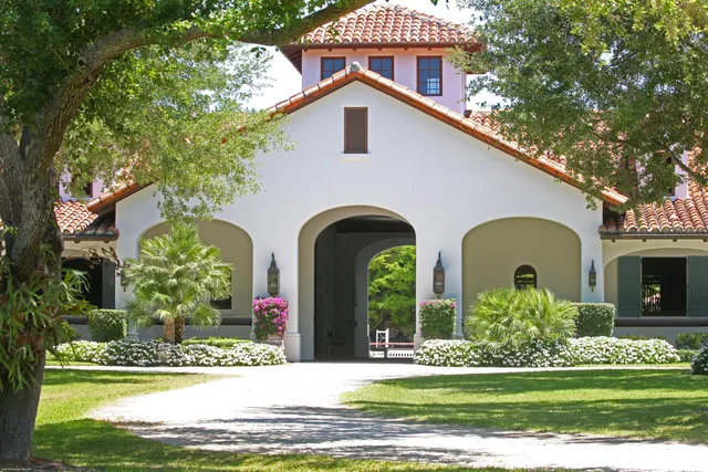 a large kitchen with a table and chairs