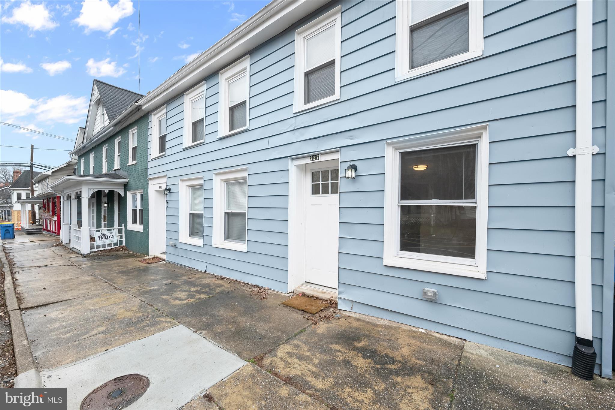 227-229 Main Street New Windsor, MD 21776 - Photo 1 of 36 a view of a house with a yard