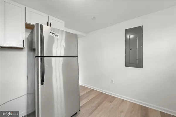 a white refrigerator freezer sitting in a kitchen