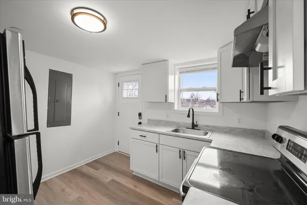 a kitchen with cabinets and window