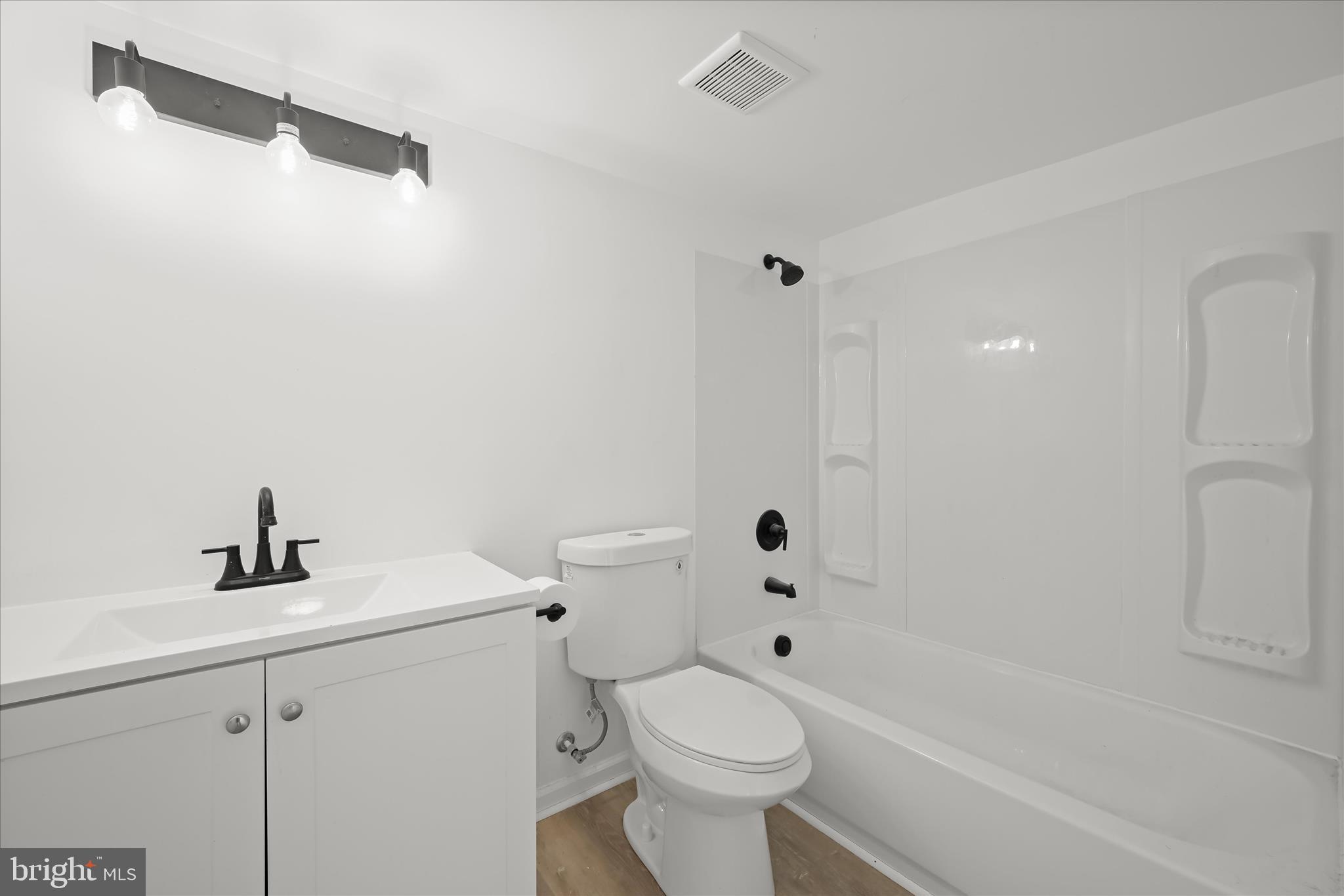227-229 Main Street New Windsor, MD 21776 - Photo 20 of 36 a white toilet sitting next to a bath tub