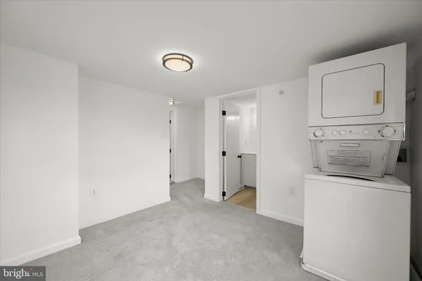 a view of a storage & utility room with a sink