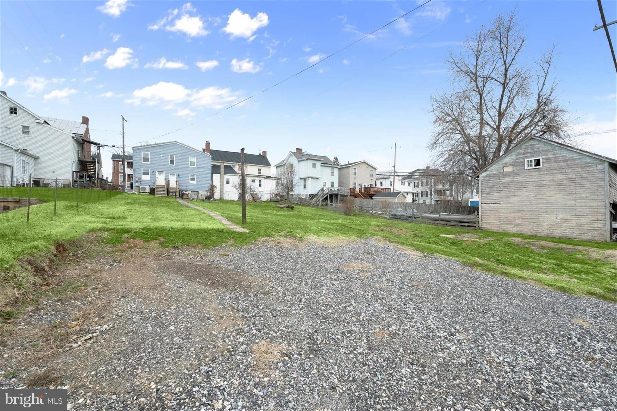 227-229 Main Street New Windsor, MD 21776 - Photo 26 of 36 a view of a house with a yard and a large tree