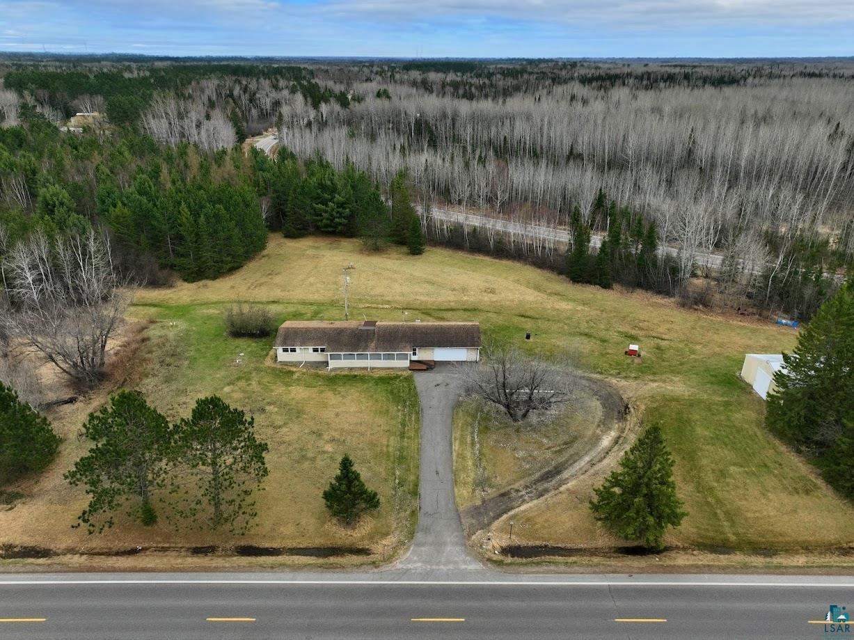 11574 Town Line Road Hibbing, MN 55746 - Photo 31 of 41 Expansive property featuring a single-story residence with a brown roof and light-colored siding
