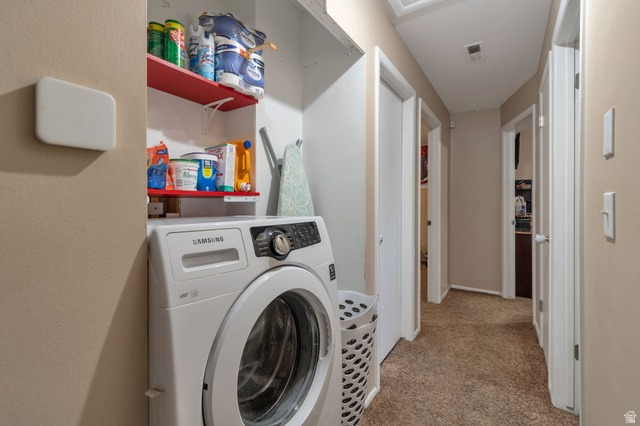 7466 Washington Road Magna, UT 84044 - Photo 6 of 21 Laundry area with built-in shelving