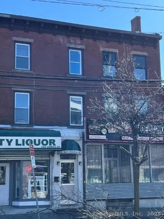 a front view of a building with glass windows