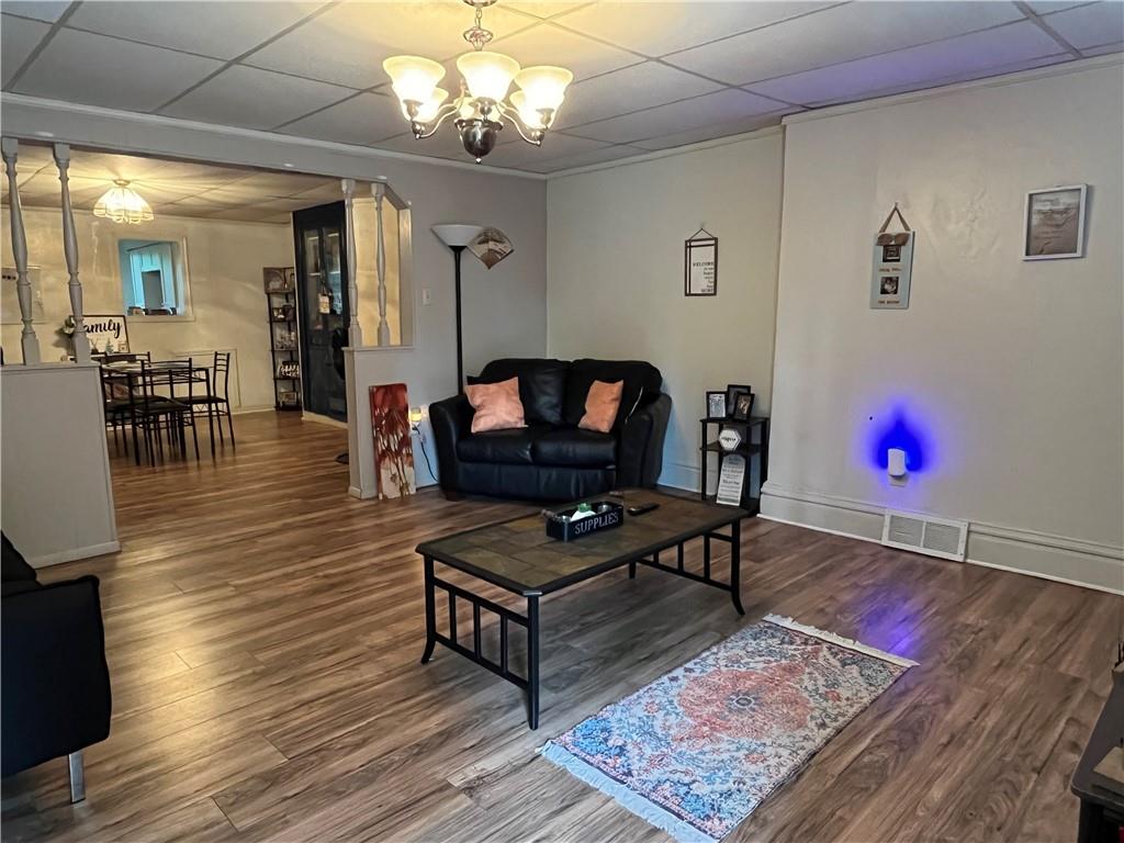 1515 Terrace Street Braddock, PA 15104 - Photo 6 of 30 a living room with furniture and a wooden floor
