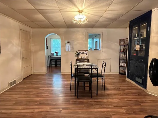 a view of a dining room with furniture window and wooden floor