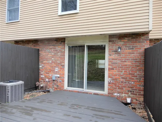 a view of a brick house with wooden floor