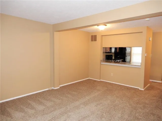 a view of a room with a flat screen tv