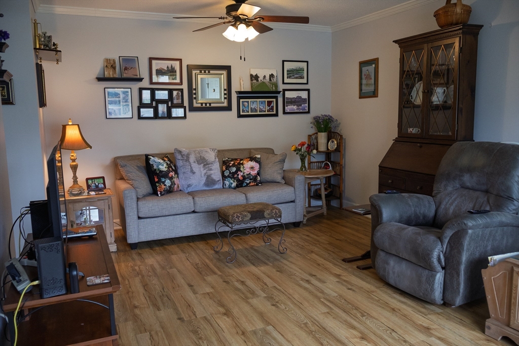 61 Outer Drive, Unit 61 Chicopee, MA 01022 - Photo 12 of 25 a living room with furniture and wooden floor