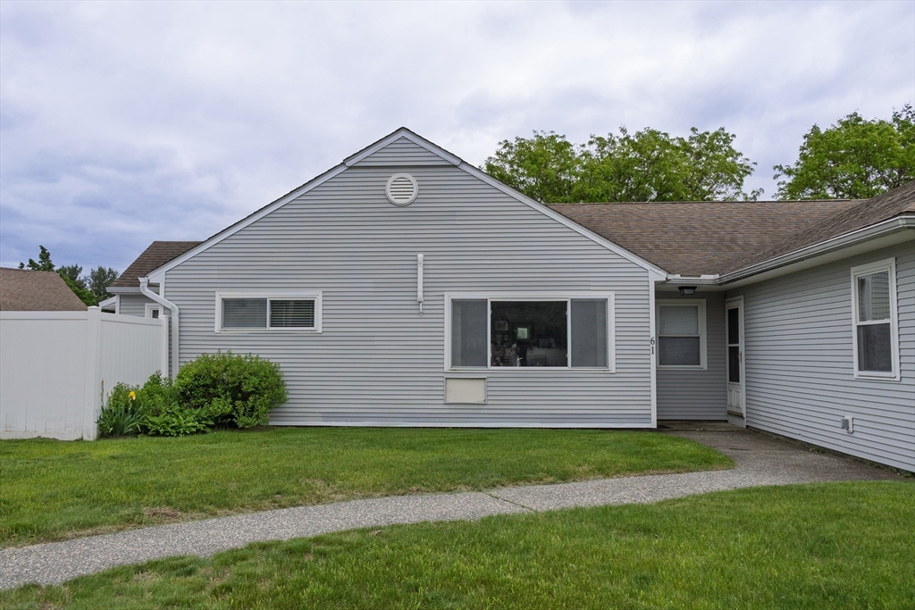61 Outer Drive, Unit 61 Chicopee, MA 01022 - Photo 20 of 25 a front view of house with yard and green space