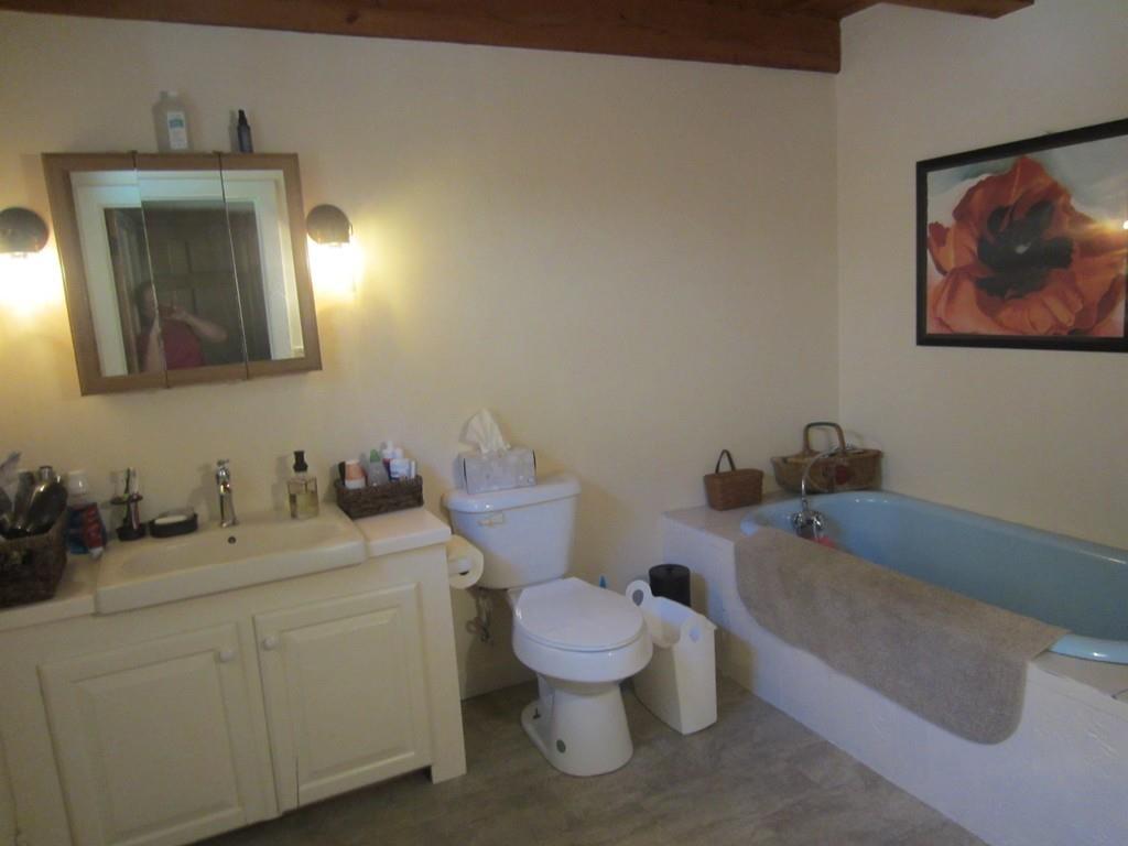 980 Walnut Plain Road Rochester, MA 02770 - Photo 23 of 31 a bathroom with a toilet a sink and a mirror