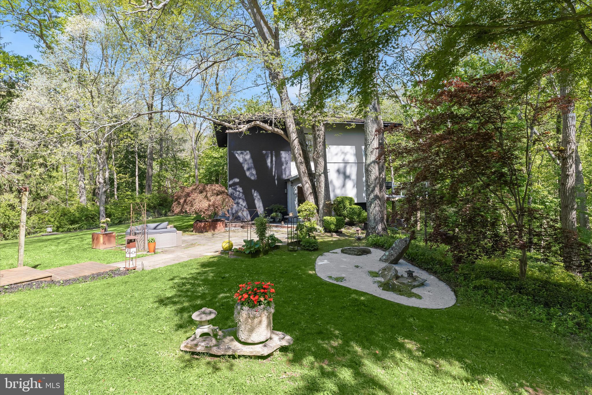 927 Buckhorn Road Sykesville, MD 21784 - Photo 122 of 147 a view of a backyard with table and chairs and a fire pit