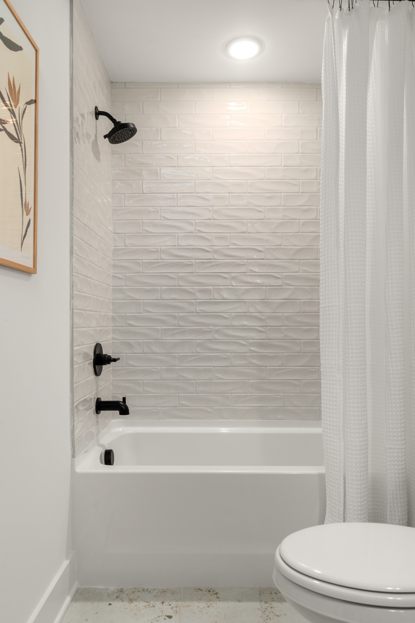 106 Chadwick Court Madison, TN 37115 - Photo 23 of 32 a bathroom with a bathtub and a toilet