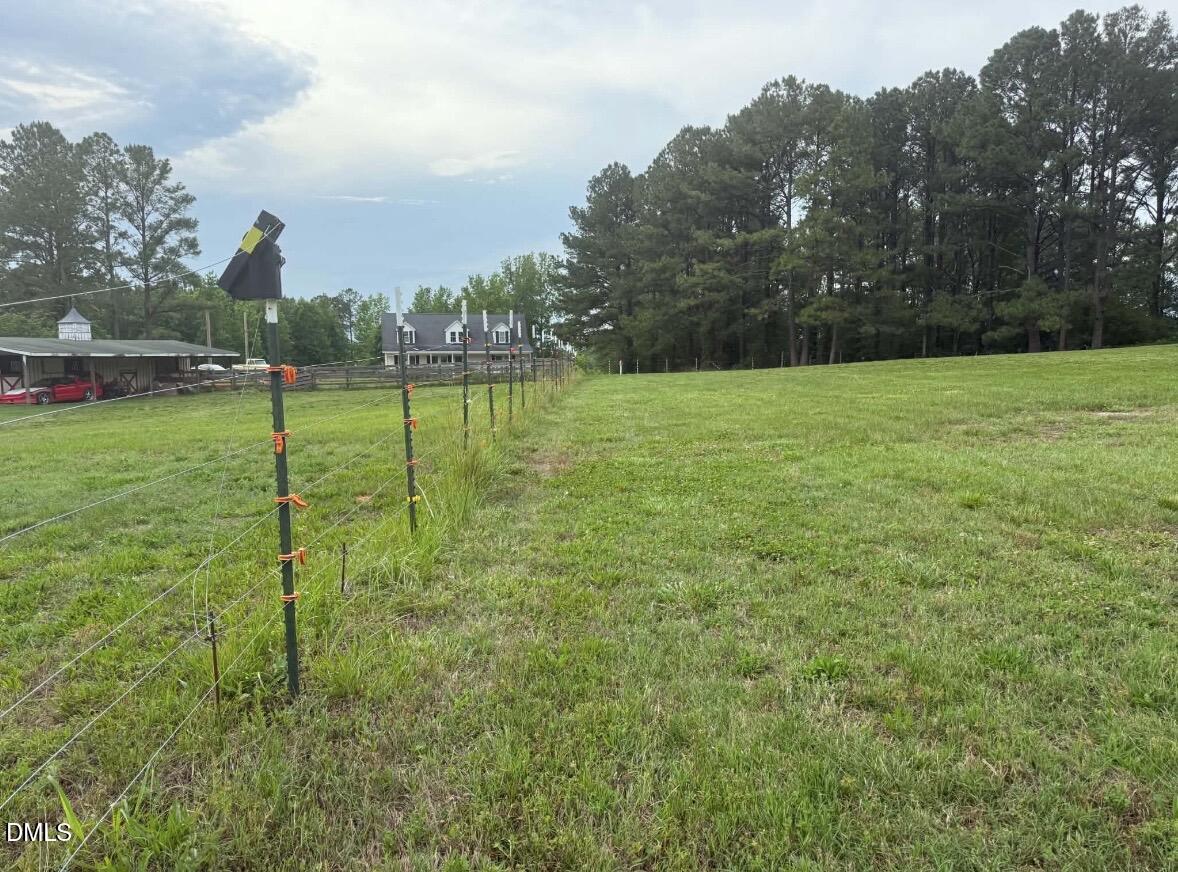 344 J B Leonard Road Castalia, NC 27816 - Photo 30 of 32 a view of a golf course with a lake